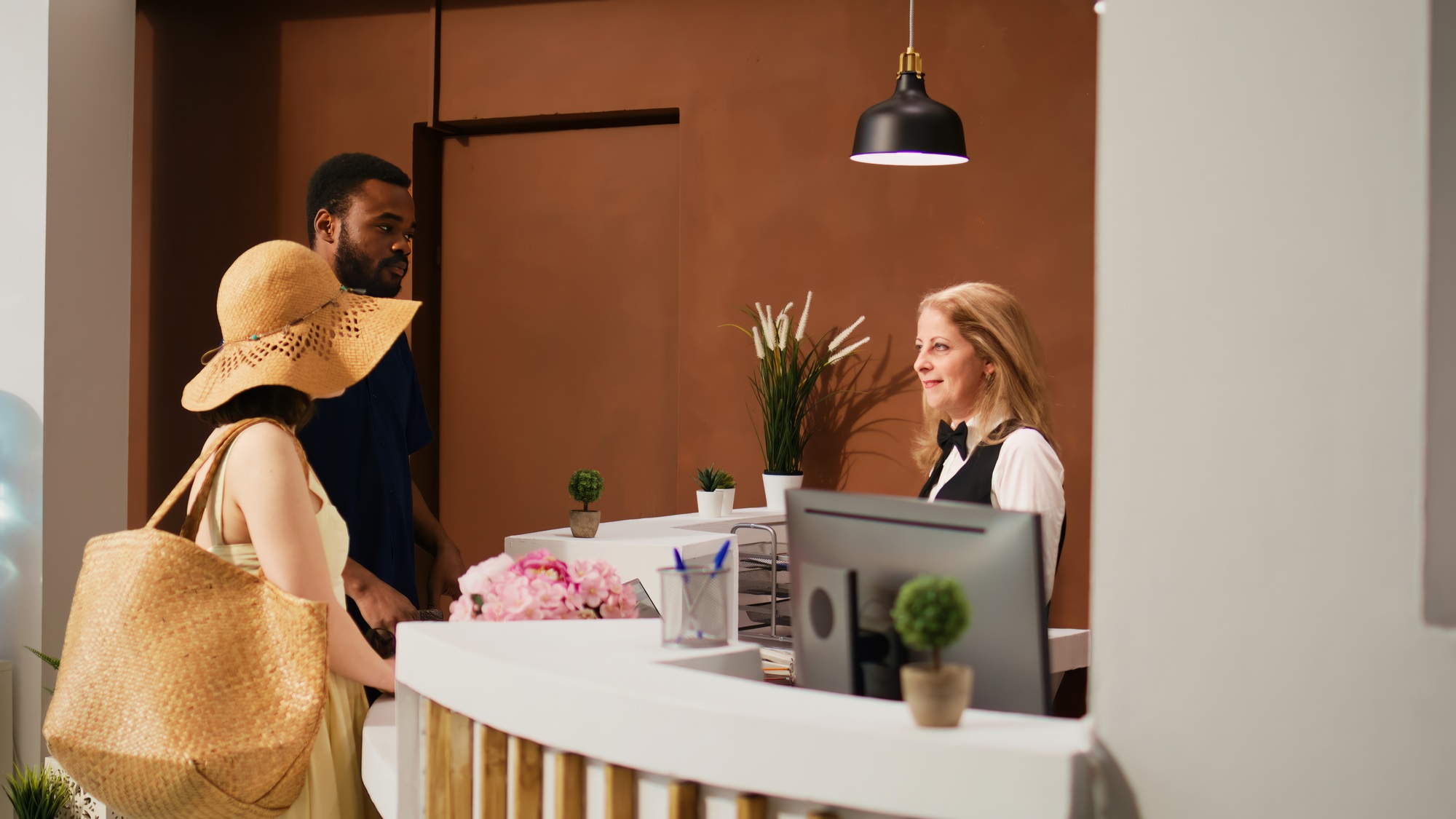 Hotel staff welcoming guests